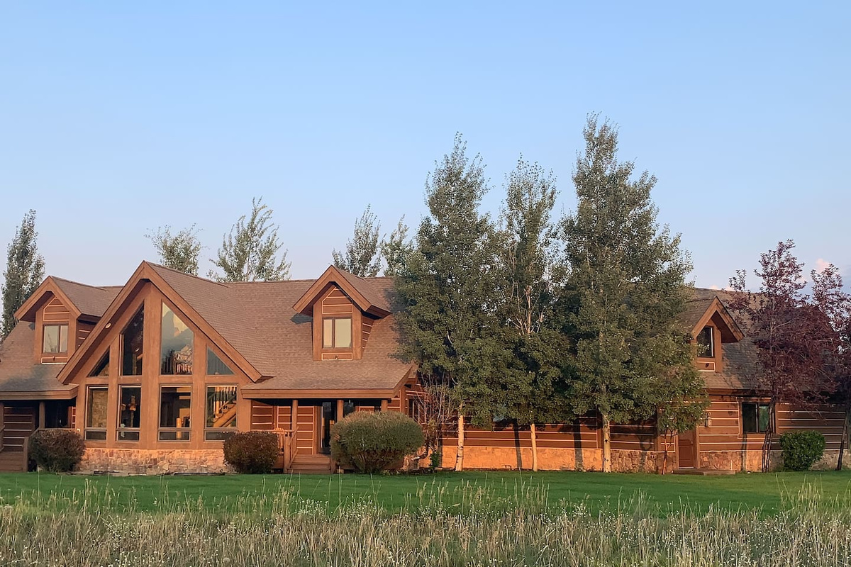 Enjoy wide-open space and fresh air at this beautiful A-frame retreat—perfect for outdoor games, group activities, and making memories on the expansive lawn. The yard faces the Tetons for amazing views!   A bit of corn-hole anyone?  