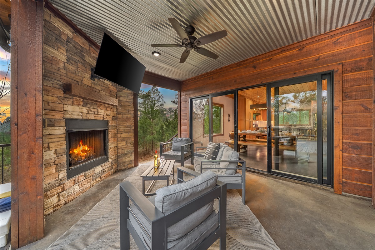 Outdoor fireplace and tv for watching the big game!