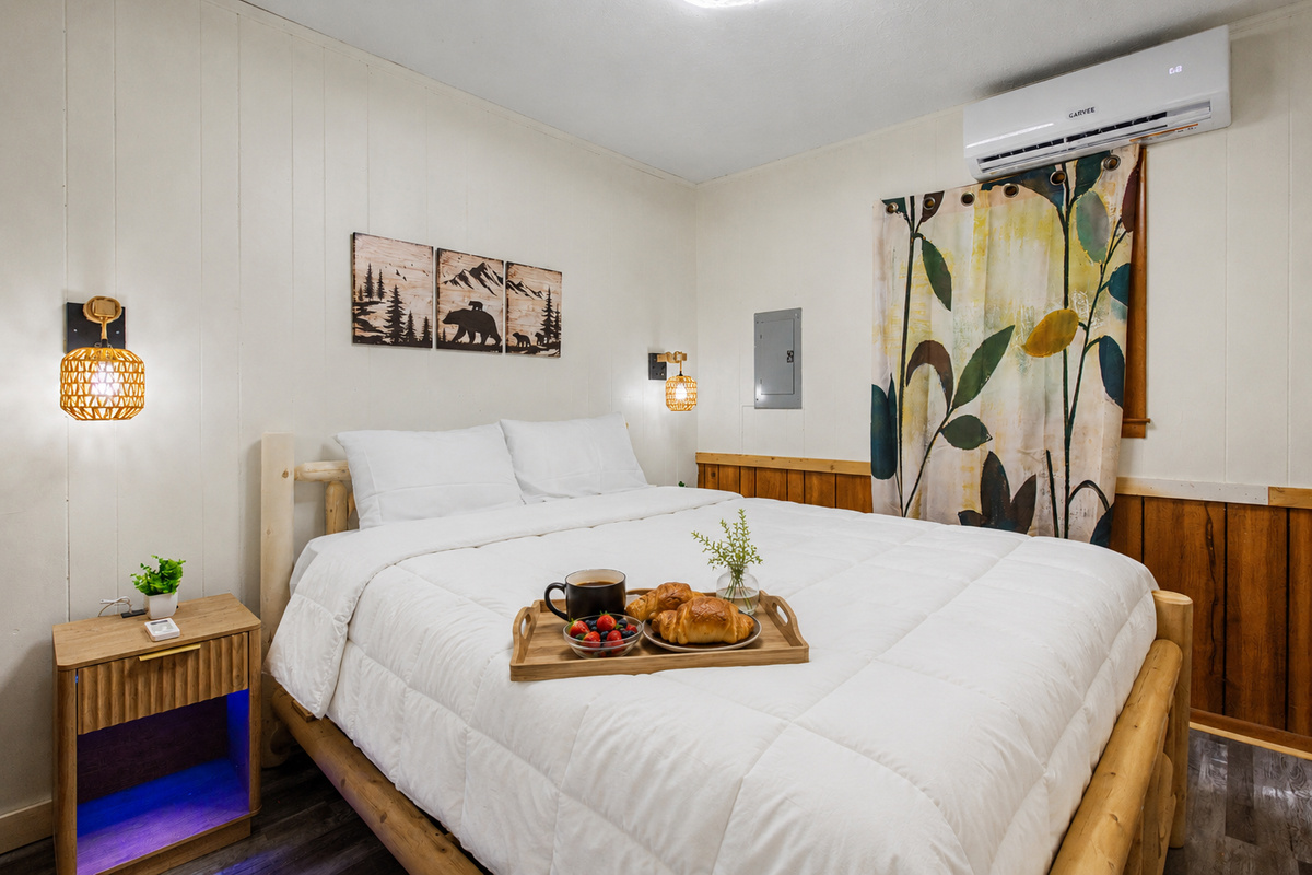 Bedroom Retreat: Enjoy rustic charm with elegant decor and a perfect tray for morning treats!
