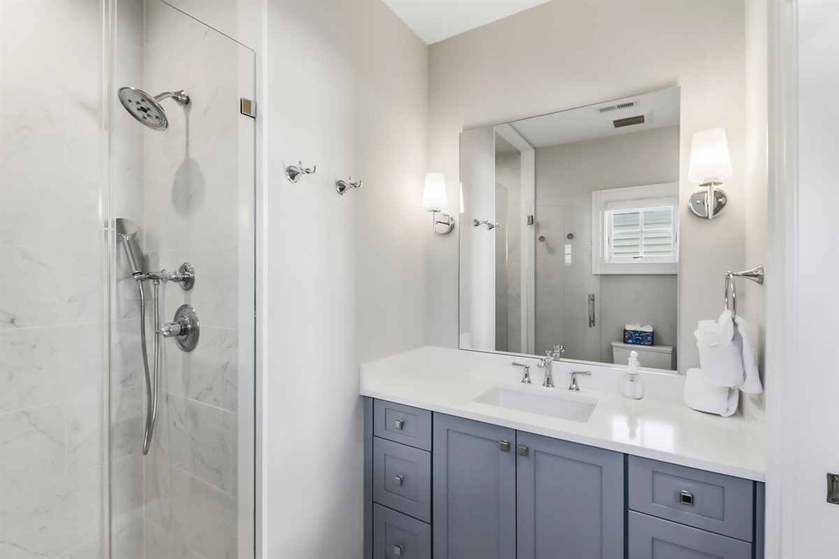 Full bathroom with a spacious vanity area