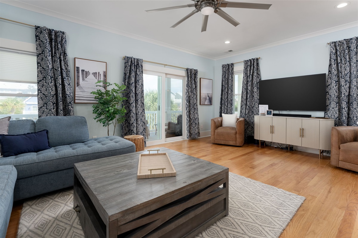 Spacious living room designed for relaxing, reconnecting, and movie nights.