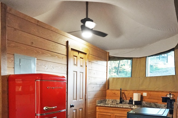 Vintage red fridge and wooden charm for your culinary adventures in nature!