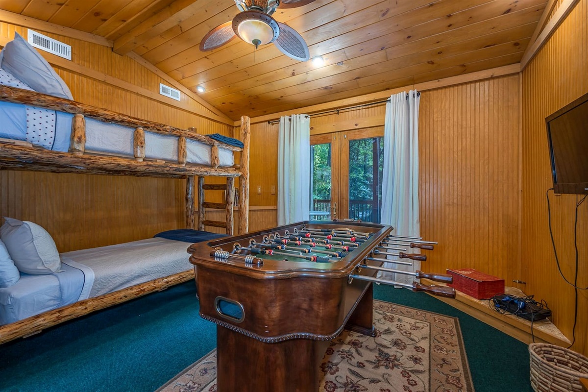 Lower level bedroom 4 with French Doors to lower deck with seating overlooking back yard, back yard pavilion and steps to lake/river/beach
