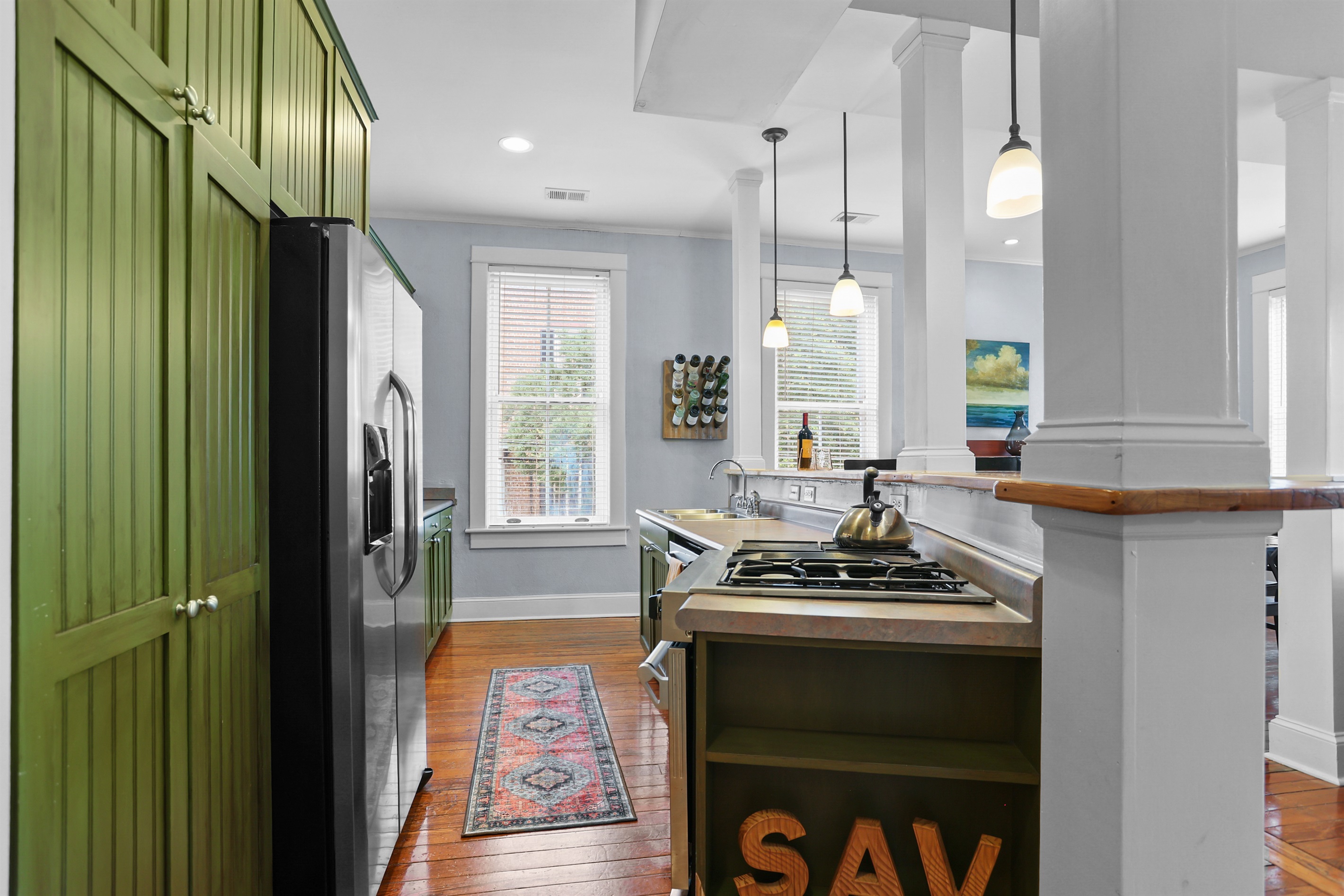 Modern appliances meet timeless charm in this stunning kitchen.