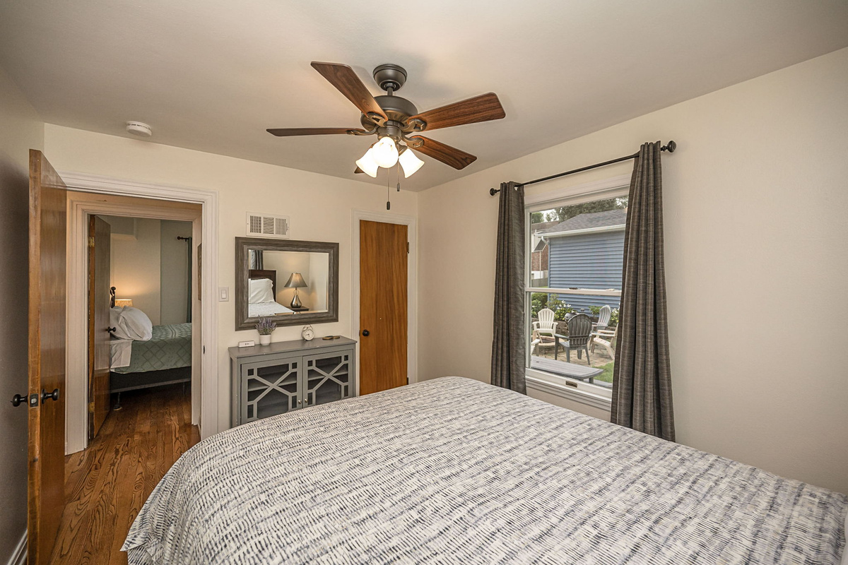Relax in the queen bedroom with views of the backyard.