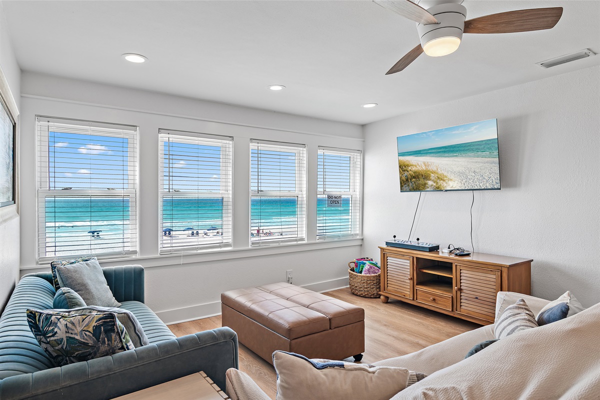 Sea Winds 8 - The 1st Floor features another Living Room w/ 65" Smart TV, multi-game arcade, Leather Sleeper Sofa, a Kitchenette with Cabinet Ice Maker -Great for the Kids!
