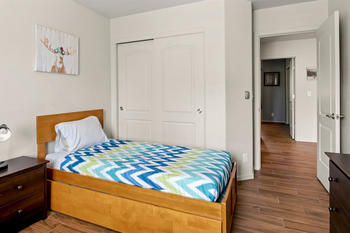 Ideal for kids or friends, the third bedroom offers two twin beds, providing a fun and comfortable space for everyone.