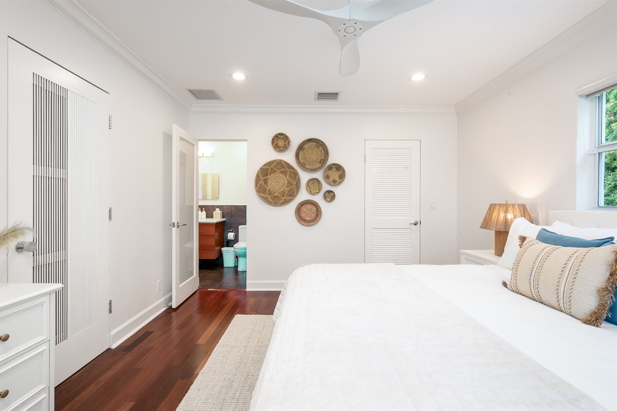 Conveniently connected to the King Suite, this sleek hall bath blends privacy and accessibility.