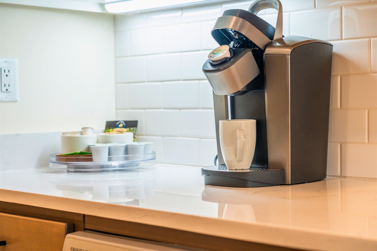 Coffee bar with Keurig and mugs for your morning routine.
