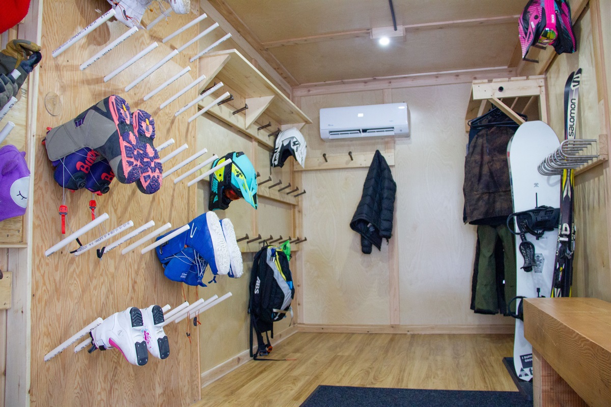 Shared custom and secure dry room and gear storage building for guest use.