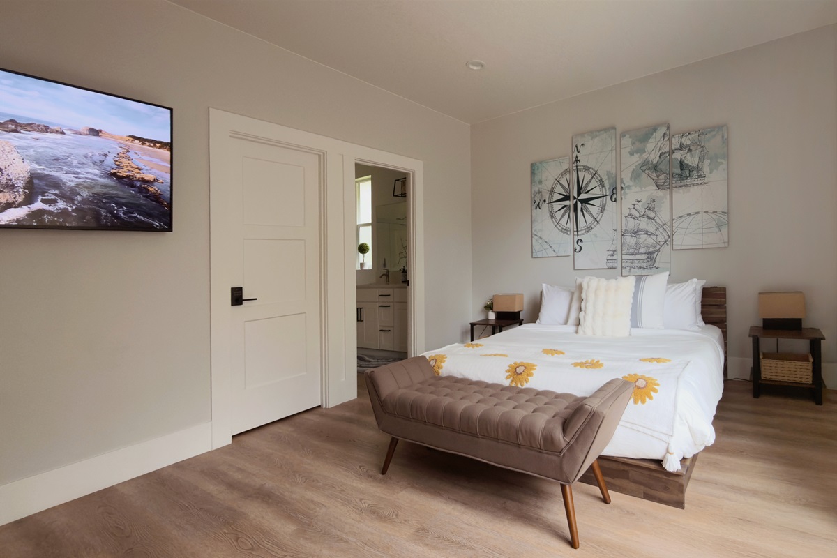 Primary bedroom with a king bed, premium soft foam mattress, hotel-grade 400-thread-count Egyptian cotton sheets, and a 55-inch smart 4K TV. True comfort while you’re on vacation.