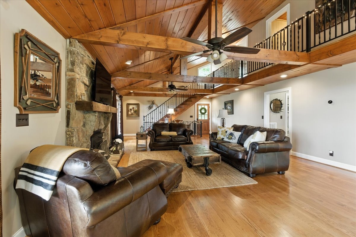 Living room is equipped with two wooden ceiling fans giving the room effective air circulation