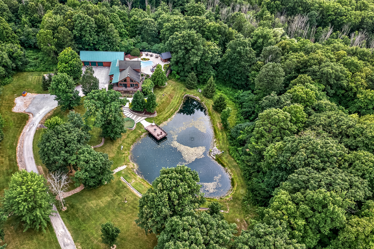 Property surrounded by dense woodland