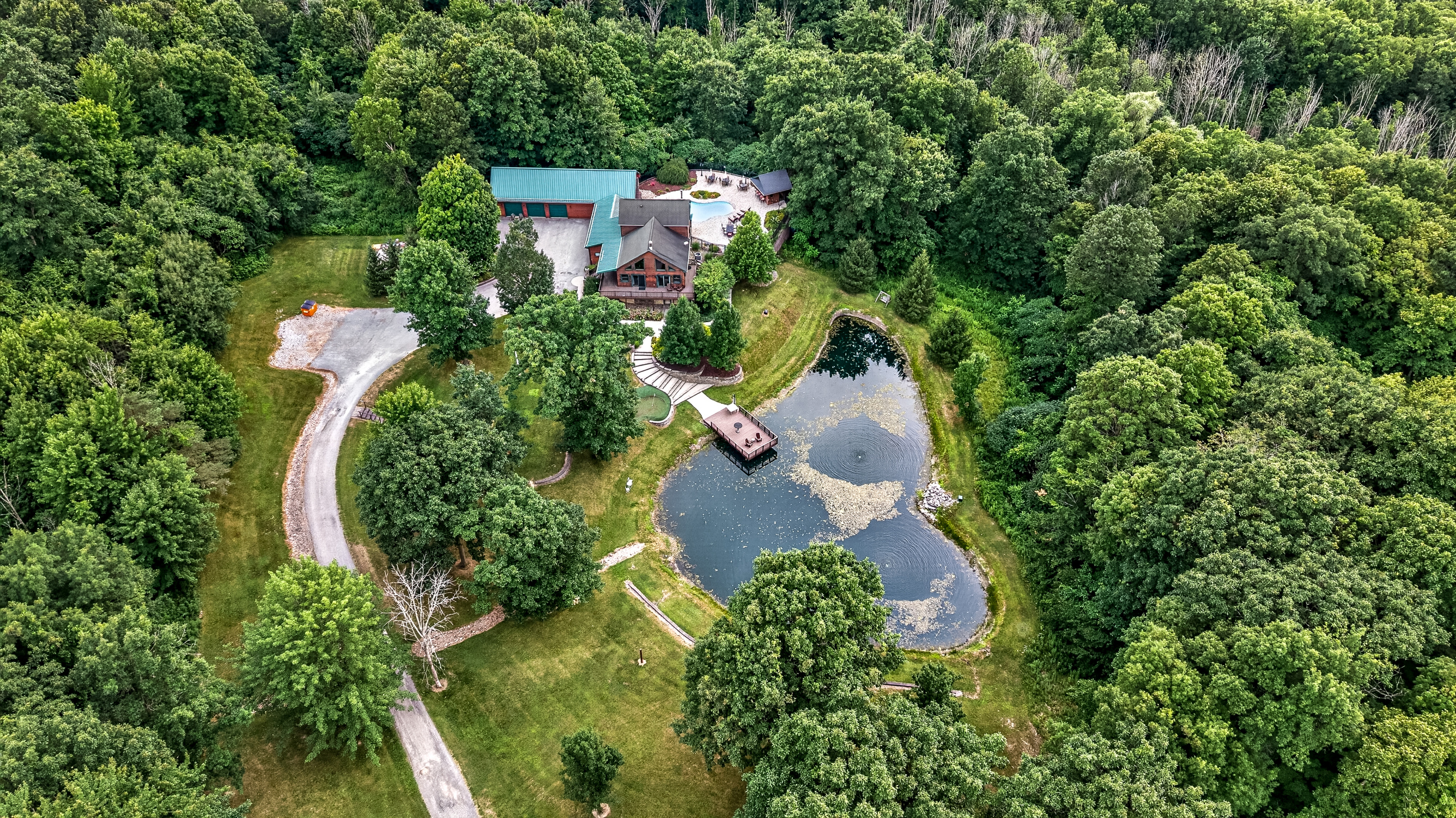 Property surrounded by dense woodland