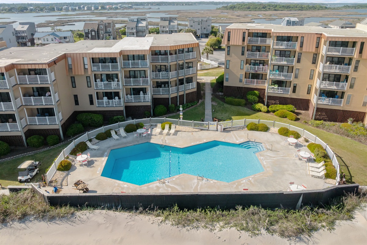 Resort-style seasonal pool overlooking the dunes, perfect for cooling off with a view