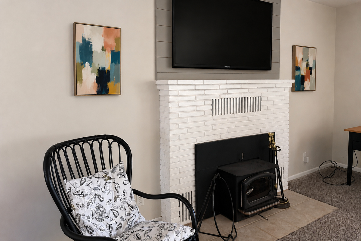 Fireplace with large screen TV above