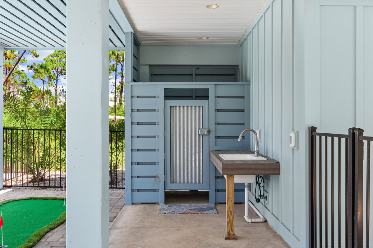 Rinse off after a day at the beach with the convenient outdoor shower before relaxing by the pool or gathering around the fire pit.