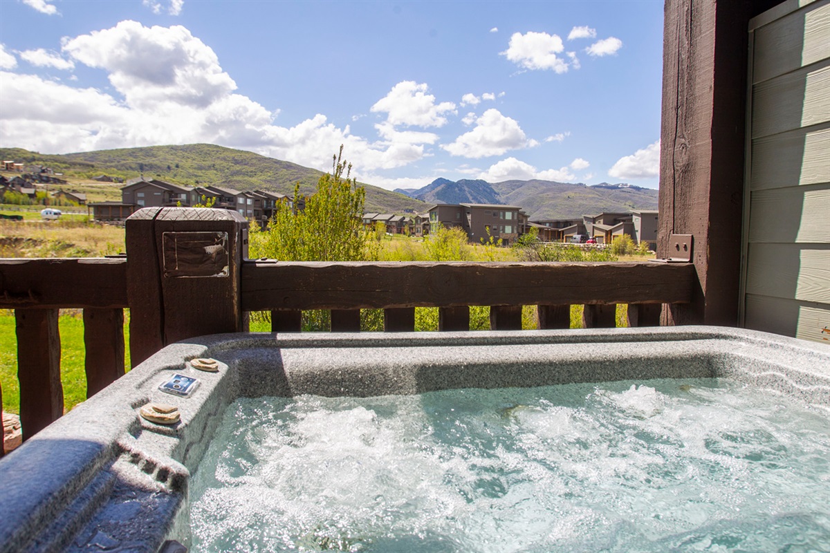 Step outside to your private hot tub and take in peaceful mountain views.