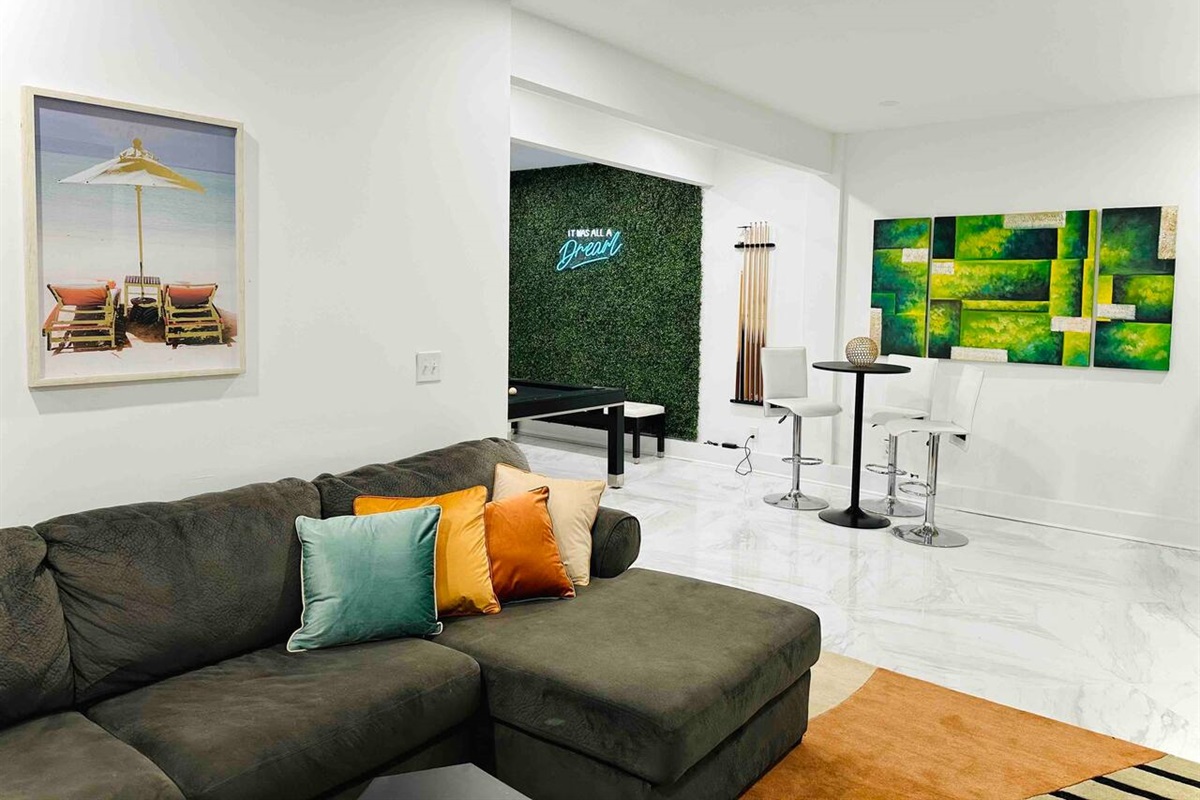 The downstairs game room has its own living room and cocktail lounge.