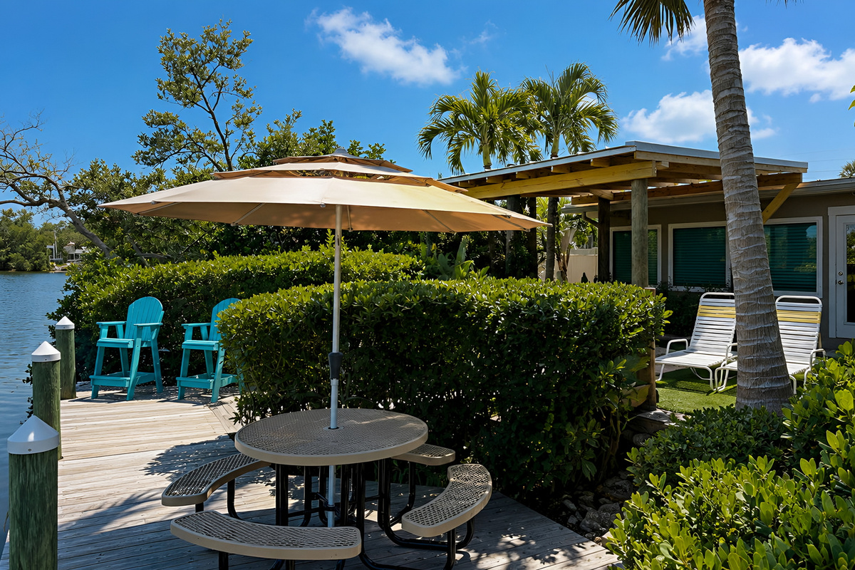 View from the Private Boat Dock to the Private Terrace of Pelican Suite at AMI Beach Lagoon