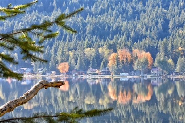 Lake view in autumn with reflections on the water.