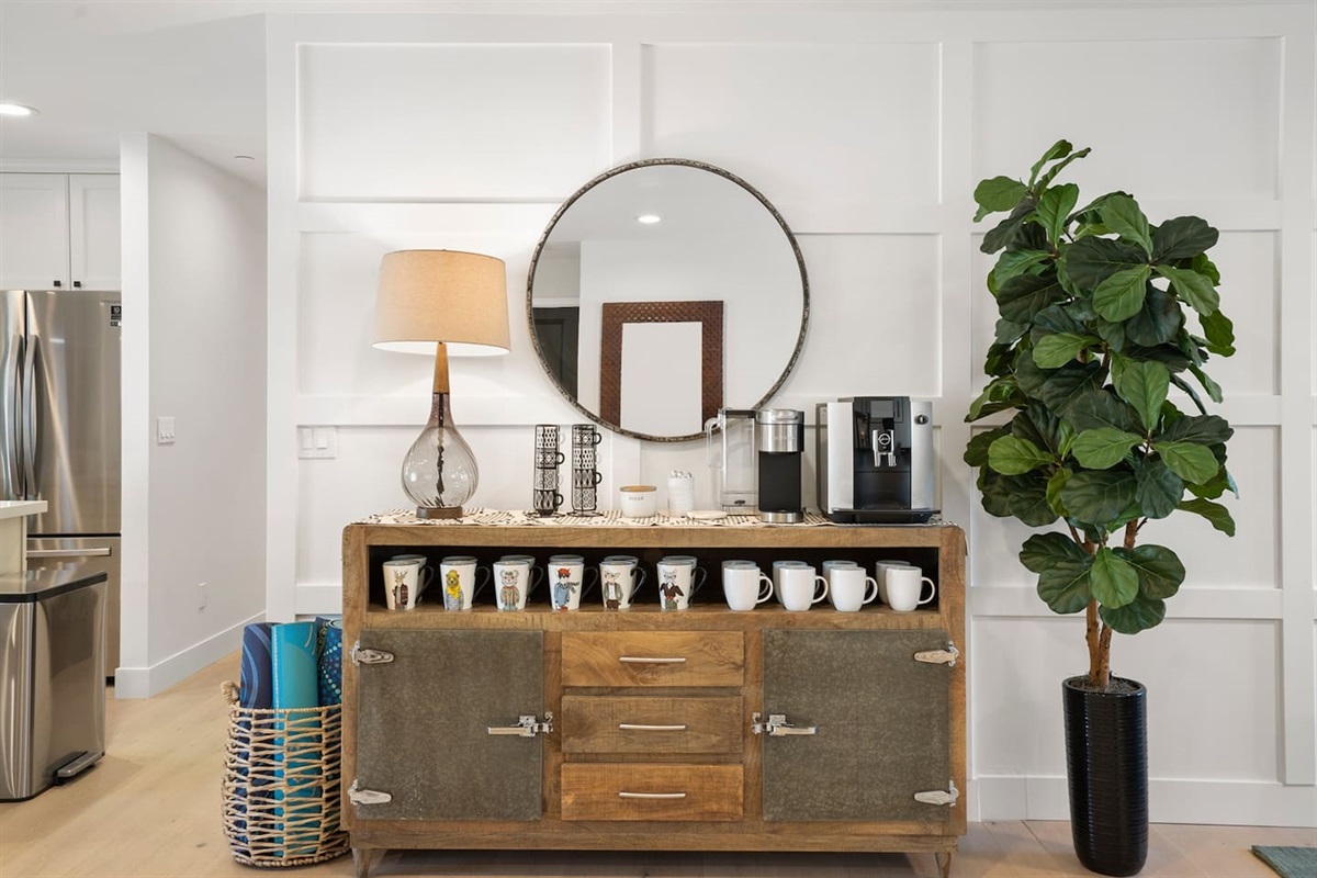 Enjoy your morning routine in the inviting coffee area, featuring an array of mugs ready for your favorite drinks. We offer fresh roasted high quality coffee in the Jura E6. We also have kcups for the Keurig.