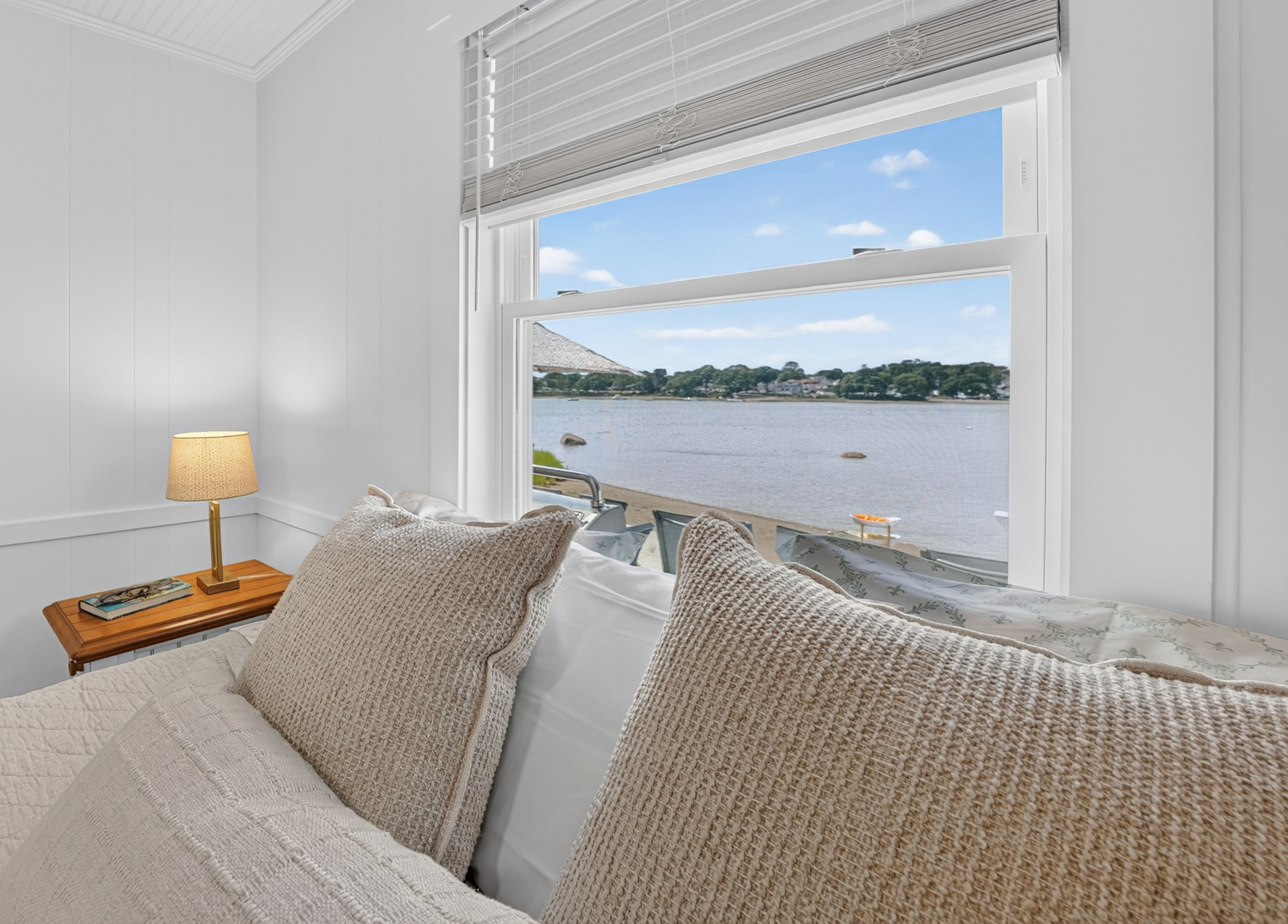 Wake up to beautiful water views from the comfort of the primary bedroom.