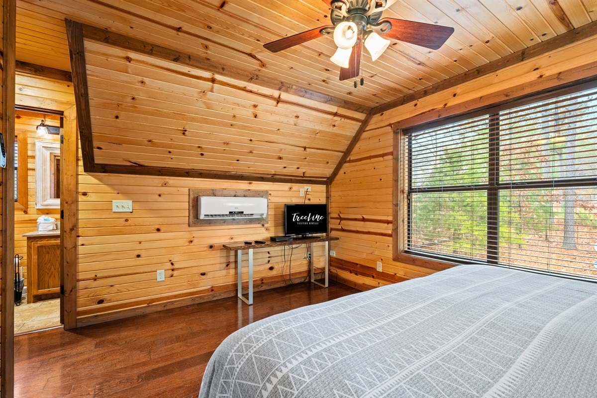 A wider view of the second bedroom highlights the natural light and open feel that make the space feel airy and peaceful.