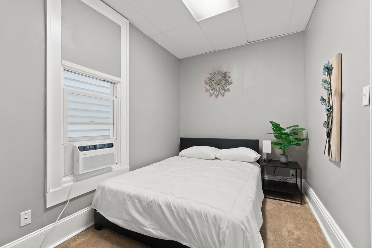 The bedroom features a plush queen-sized bed for ultimate comfort and relaxation.