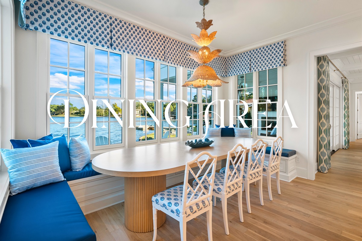 Formal dining setup with lake views and refined detailing.