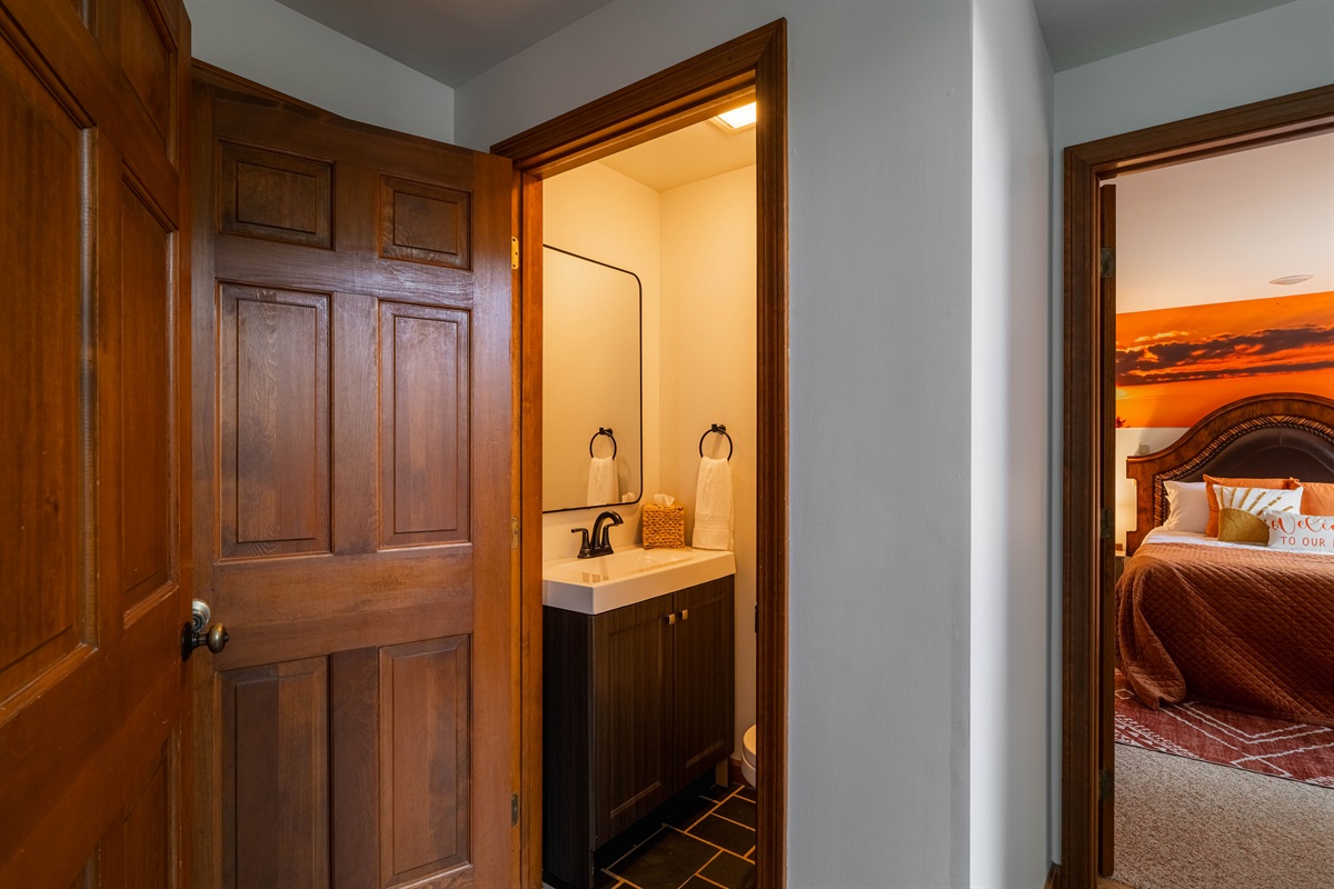 This bedroom features an attached bathroom for added privacy and convenience.