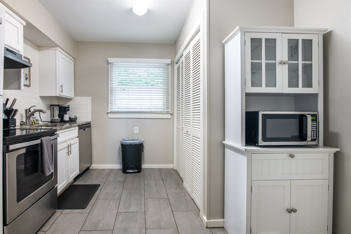 Clean and bright bathroom with fresh towels and essential amenities provided.