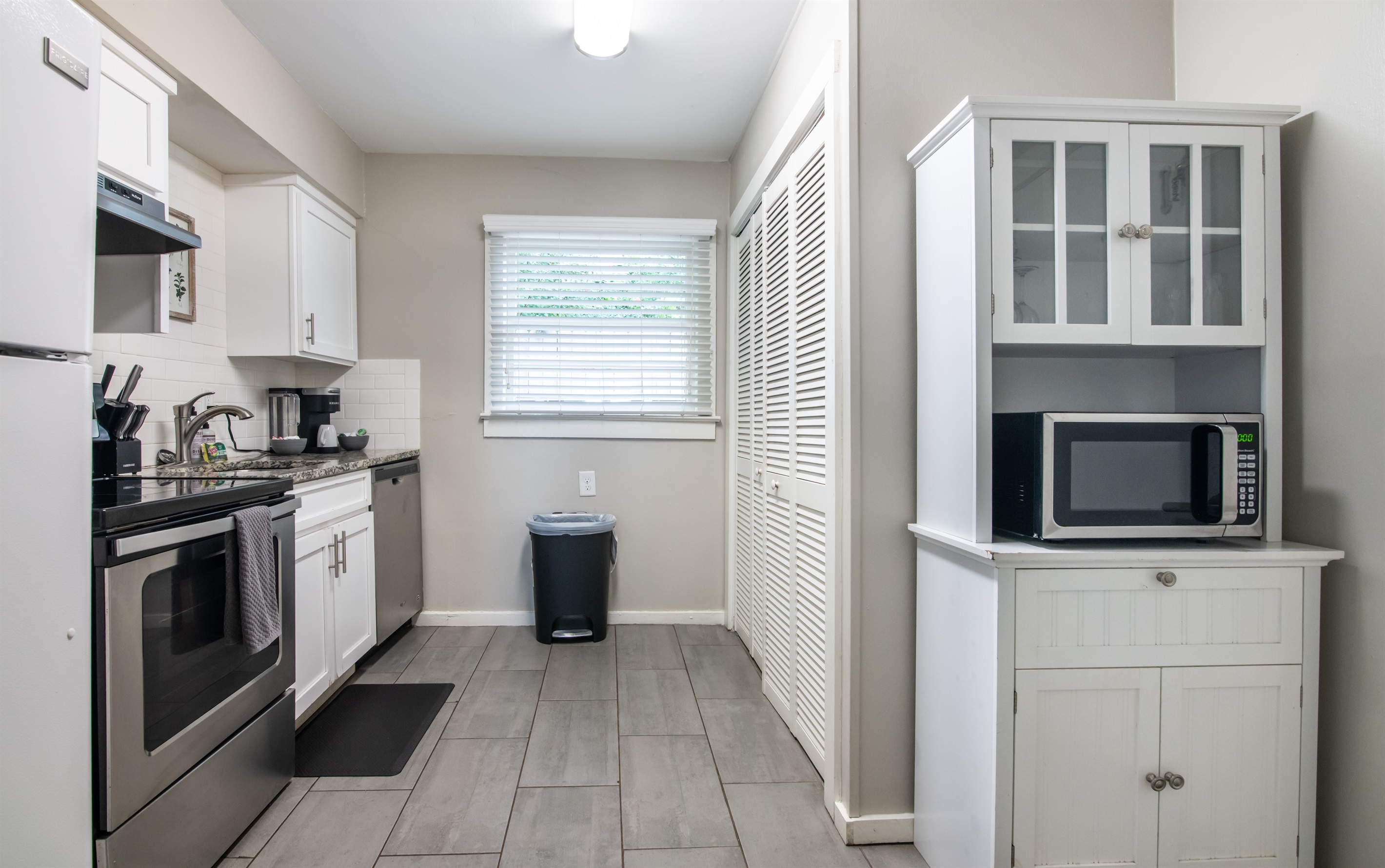 Clean and bright bathroom with fresh towels and essential amenities provided.
