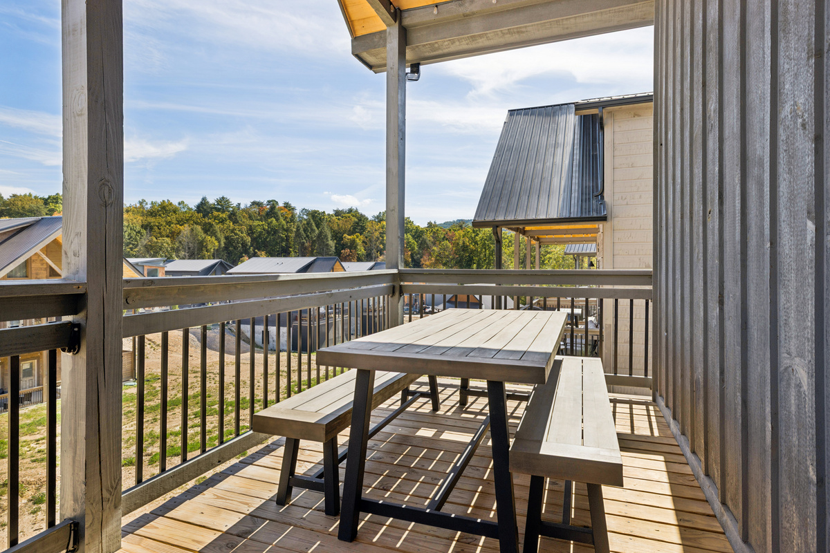 Outdoor dining next to the propane grill on the main level deck.