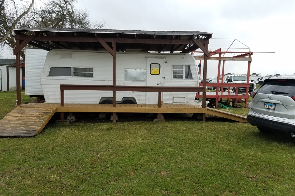 Happy Camper Skydivers Haven on the Skydive Chicago Dropzone.  Happy Camper has sleeping for two, a deck for enjoying the sunsets and socializing, and parking for two.