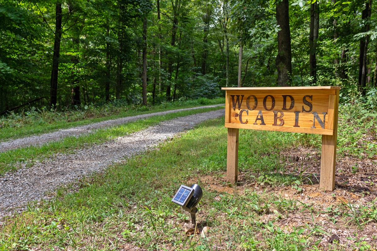 The Woods Cabin welcomes you, day or night.