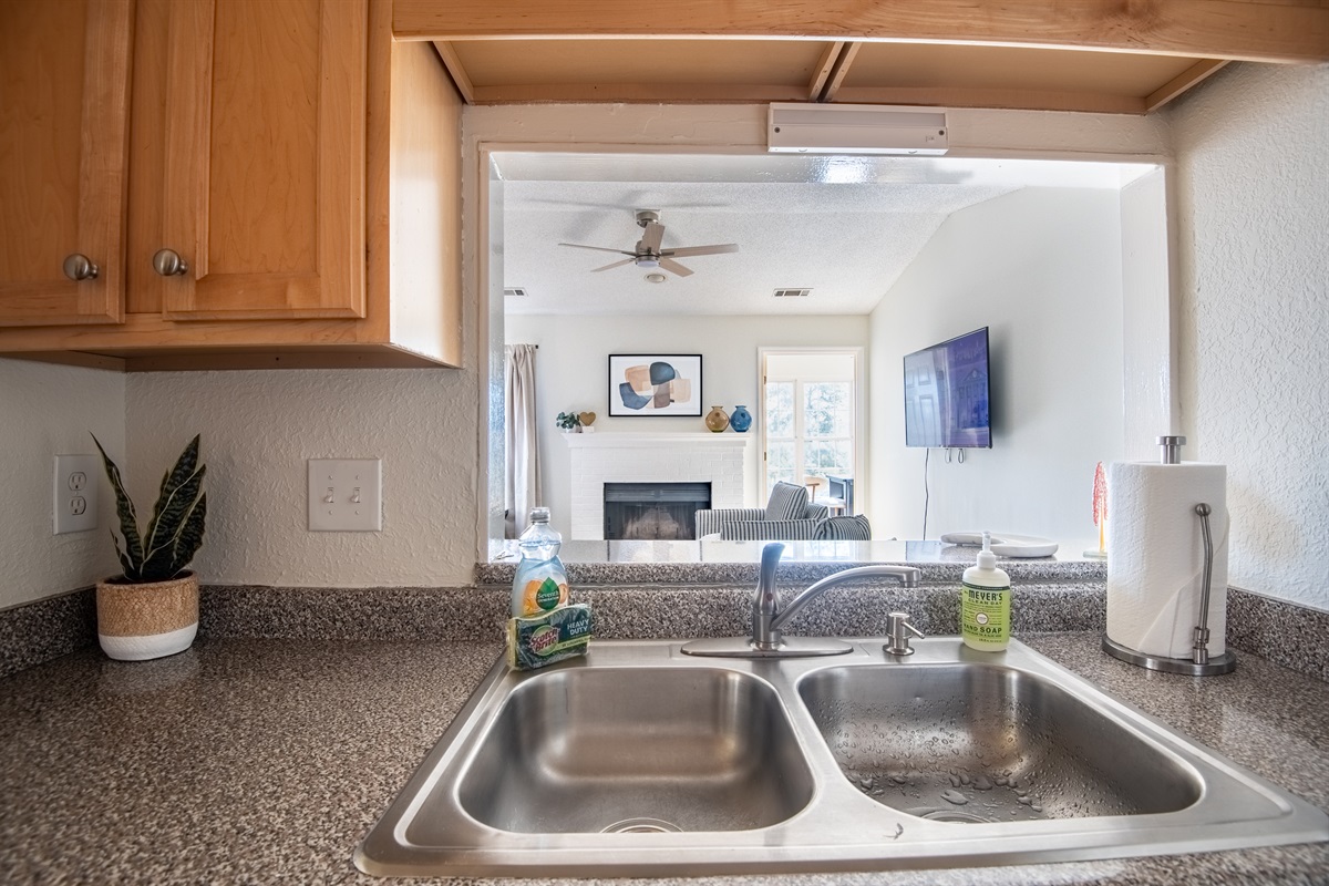 The open kitchen design helps you stay connected to the living space around it.
