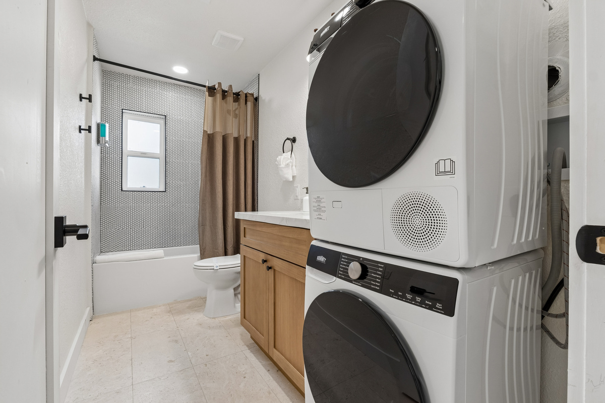 The laundry facilities are located in the hall bath.