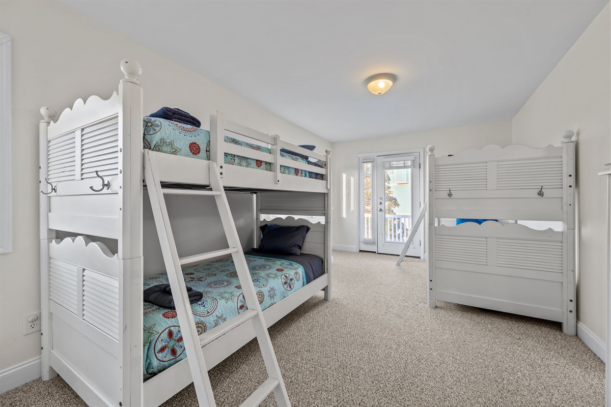 Spacious bunk room with multiple beds&mdash;perfect for kids, groups, and shared stays