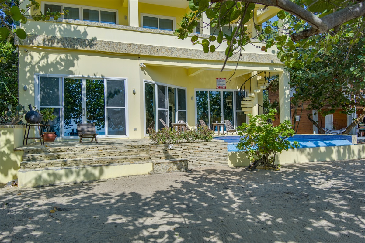Four step from the beach to the pool deck, BBQ and chairs