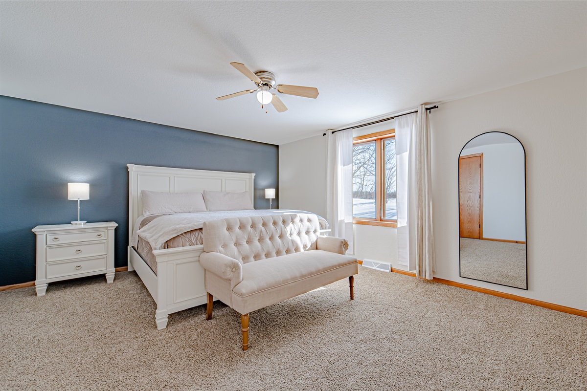 Master Suite fully equipped that features beautiful views of the lake, king size bed, smart TV, and walk-in closet!