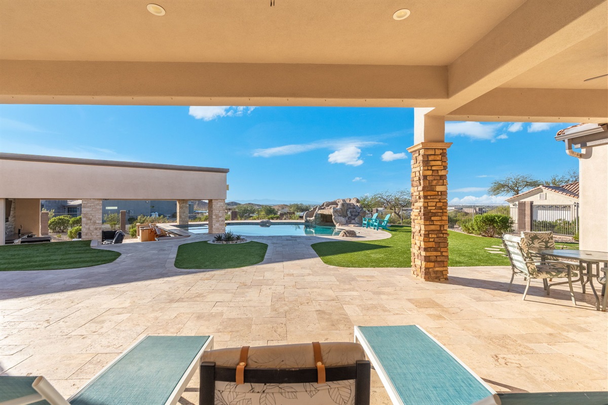 Expansive backyard patio with open desert views offers space to relax, play, and enjoy Arizona’s year-round sunshine