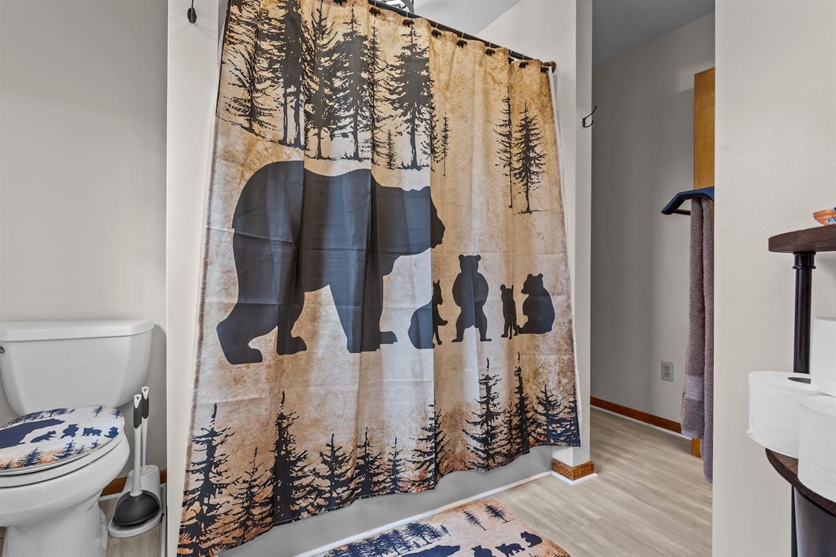 Bathroom Retreat: Unwind with nature-inspired decor and playful bear-themed accents!