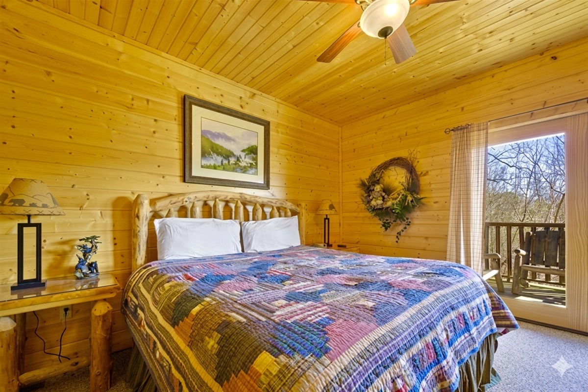 Bedroom #3 - Wake up to sunlight streaming through the windows and the peaceful rustle of the trees. This inviting bedroom blends rustic charm and comfort for a truly restful escape.