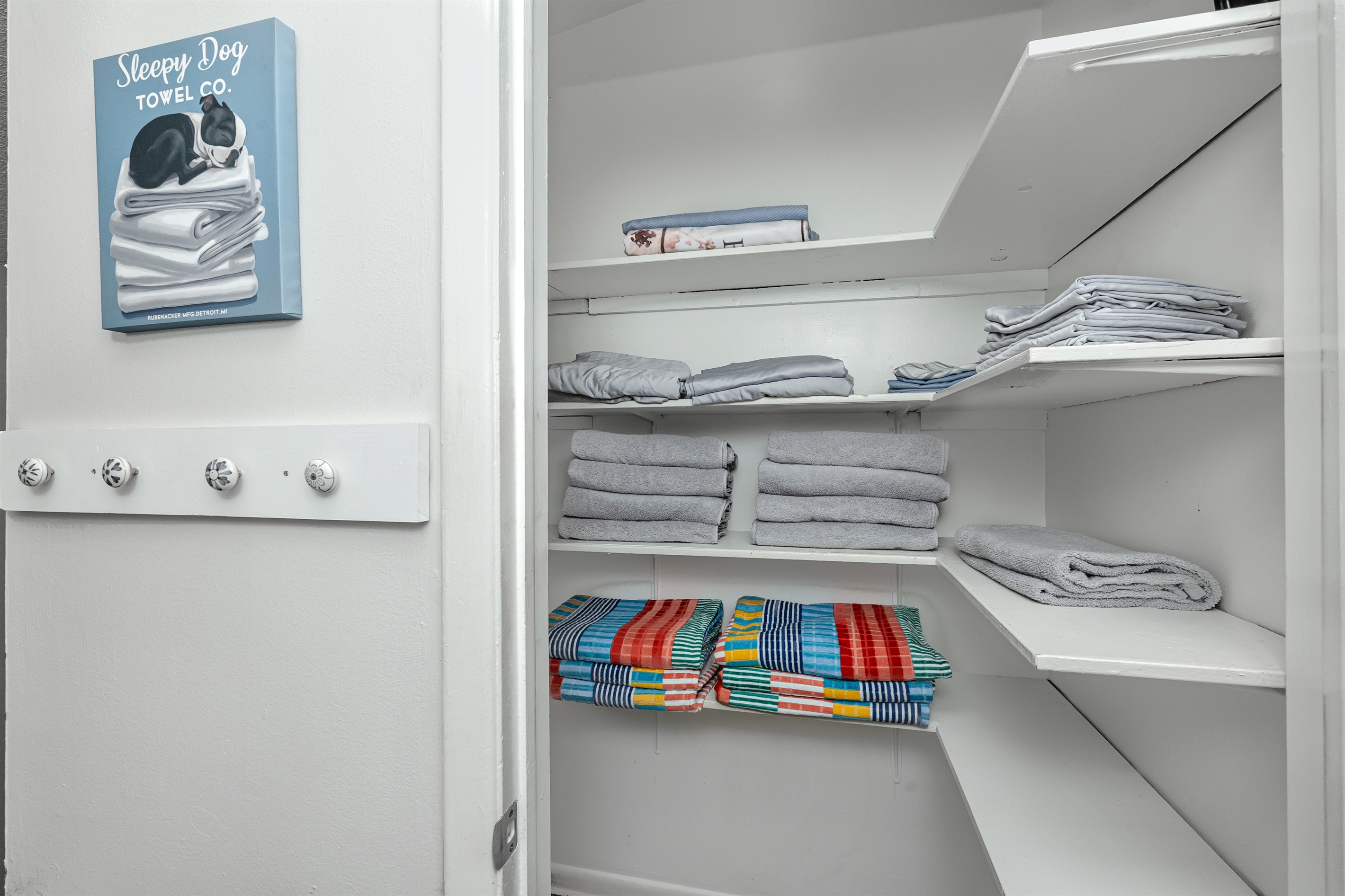 Hallway closet with towels and linens 