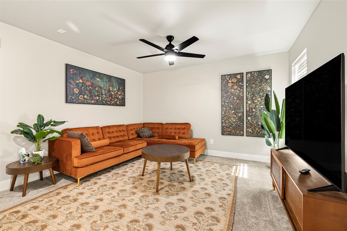 Upstairs living room with lots of natural light.