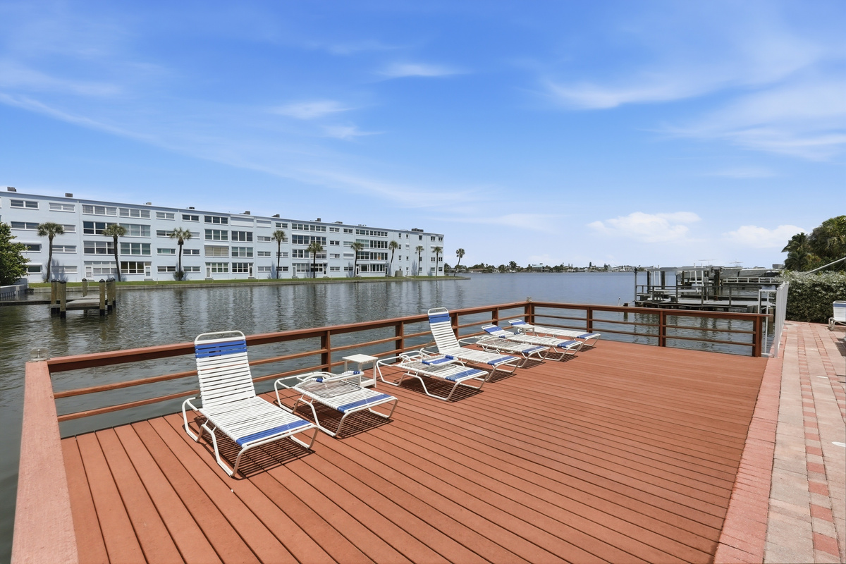 Enjoy access to the shared heated outdoor pool, where you can cool off, soak up the Florida sunshine, and take in the stunning bay views from the pool deck.