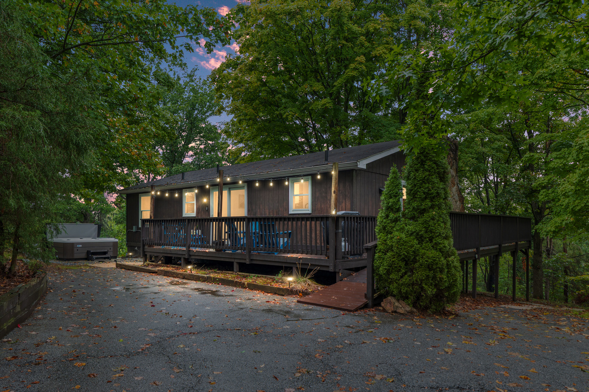 As the sun sets over Berkeley Springs, string lights twinkle and the hot tub steams — your cozy cabin retreat is ready to welcome you home.