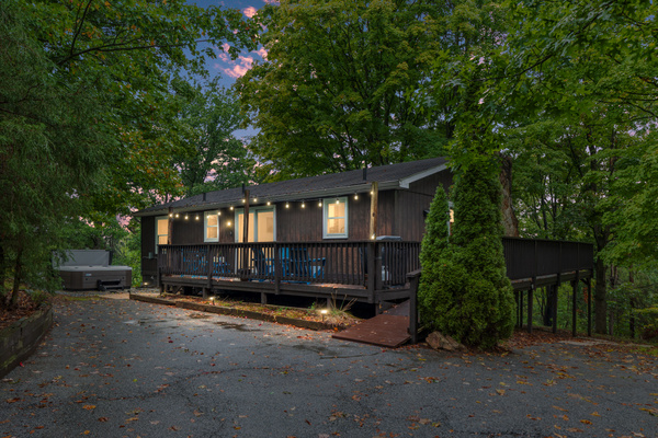 As the sun sets over Berkeley Springs, string lights twinkle and the hot tub steams — your cozy cabin retreat is ready to welcome you home.