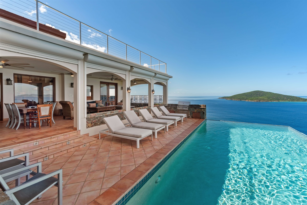 The pool deck has a whopping 5 loungers and two chairs along with the fanciest propane grill you will ever encounter.